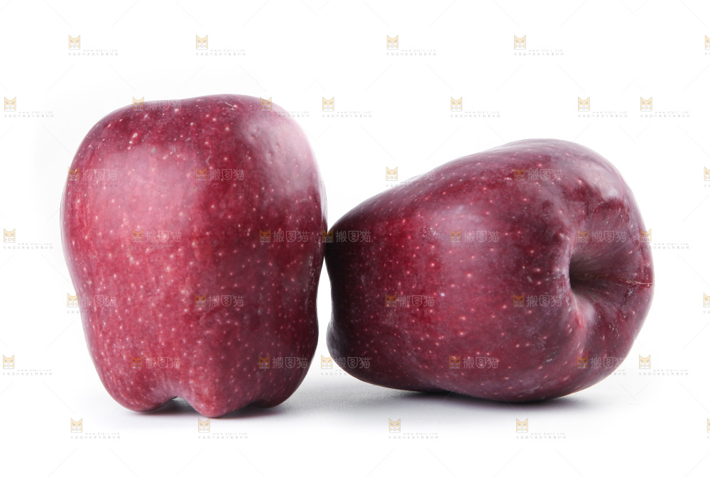 白底上放着花牛苹果