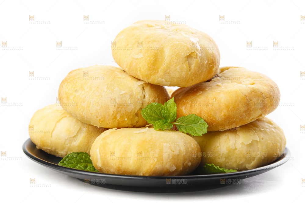 白底上摆放着一堆苏式月饼