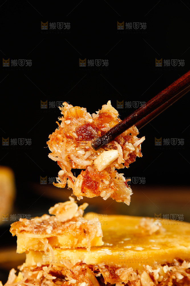 筷子上夹着椰丝饼